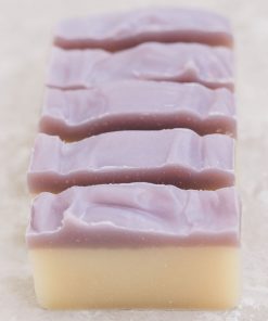 three bars of petals and patchouli handmade organic soap purple and white layers with cornflower petals for cleansing skin with essential oils