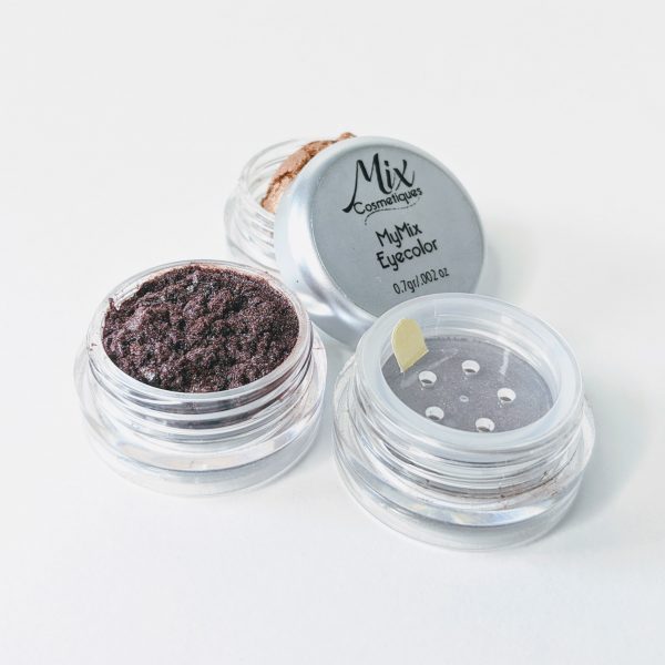 custom eyeshadow in three containers with a copper eyehadow a duo chrome eyeshadow with purple undertones and a neutral eyeshadow on white background