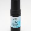 A foaming silk face wash in a sleek black bottle, that will dispense airy, luxurious foam to cleanse skin gently while leaving the microbiome intact