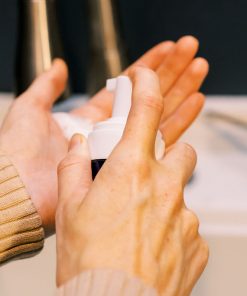 A close-up of the silky natural silk face wash being pumped into hands highlighting hydration and glow