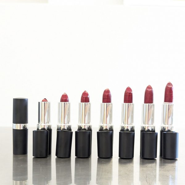 Moisturizing personalized lipstick customized for each person shown in a bold red shade with rich, buildable color—crafted with natural, plant-based ingredients for a smooth, nourishing finish.