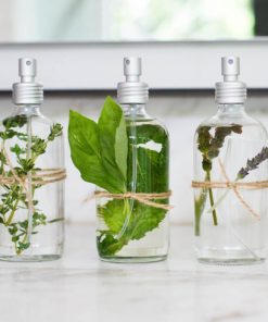 pretty glass bottles full of all natural bespoke perfume or room spray with bright botanicals, organic ingredients, only plant-based and made by you in our DIY workshop in duluth superior
