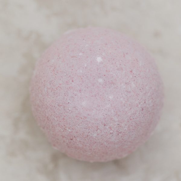 Pink bath bomb with jasmine and grapefruit essential oil and beet juice extract for natural color