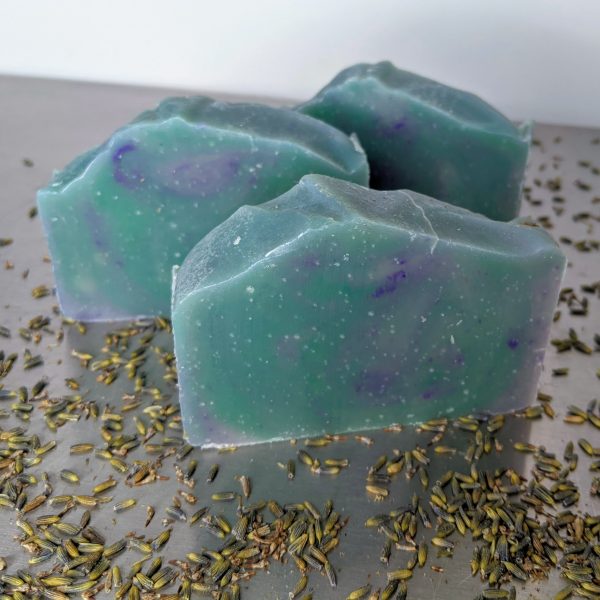 Green and purple handmade soap with lavender and tea tree, lavender buds three bars of soap