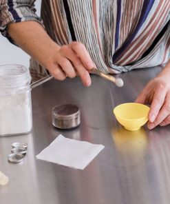 making a customized mineral eyeshadow in a neutral brown tone it will be a four color palette each well can be replaced for sustainability