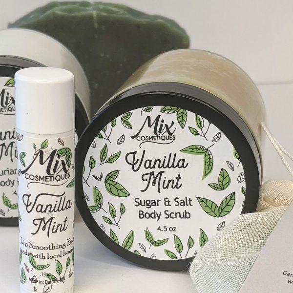 Vanilla Mint body polish pictured with handmade bar soap, body butter and smoothing lip balm