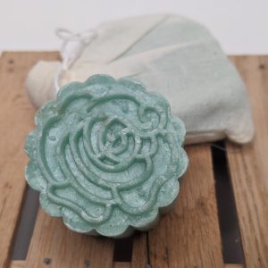 Rich results on Google's SERP when searching for "shampoo bar" green shampoo bar with floral pattern and second shampoo bar in muslin packaging made with juniper, rosemary and lime essential oils for dry hair and dandruff
