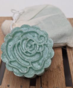 Rich results on Google's SERP when searching for "shampoo bar for dry hair" green shampoo bar with floral pattern and second shampoo bar in muslin packaging made with juniper, rosemary and lime essential oils for dry hair and dandruff