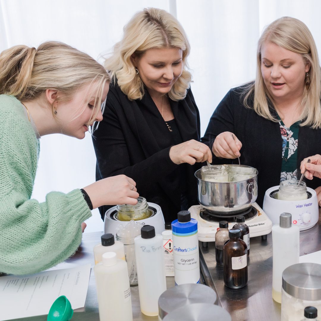 group of women making custom organic lotion at a Mix Cosmetiques workshop experience thing to do in duluth superior using natural oils and essential oils
