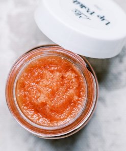open jar of fresh berry lip scrub and lip polish made with organic freeze dried strawberries to show consistency