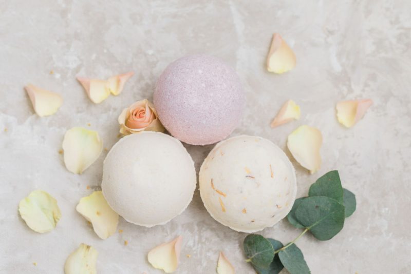 Colorful bath bomb assortment, pretty flower petal and citrus ingredient scattering from DIY class in Duluth #thingstododuluth