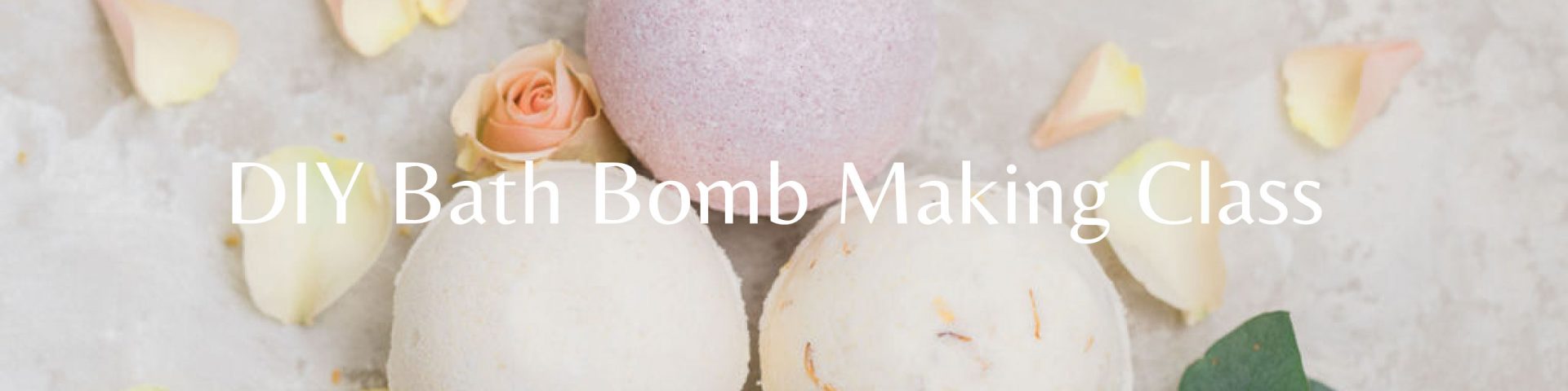 Colorful bath bomb assortment, pretty flower petal and citrus ingredient scattering from DIY class in Duluth