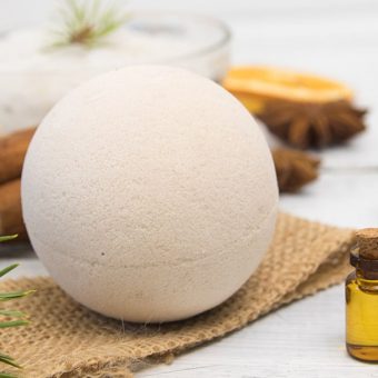 perfect bath bomb ball with cinnamon, evergreen, orange, and burlap
