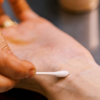 trying swatch of custom concealer on wrist