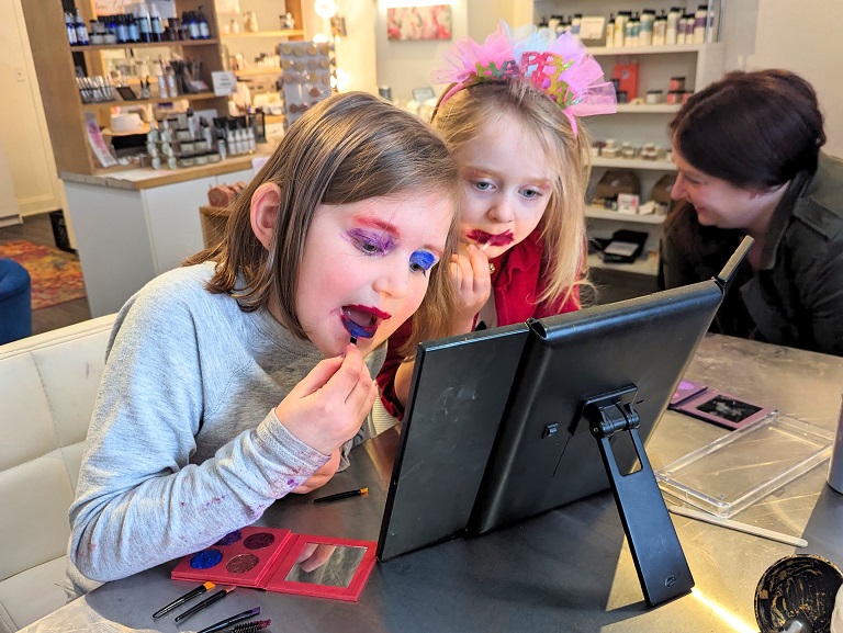 using their new organic cosmetics with safe and organic ingredients at a birthday party hosted by Mix Cosmetiques when looking for private party venues in superior or duluth