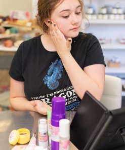 teenager applying bb dream dewy glow foundation a custom tinted foundation with rosehip oil benefits, cucumber extract benefits, cranberry seed oil benefits, it is non-pore clogging makeup, gentle on skin, antioxidant-rich foundation.