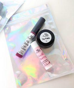 Holiday lip care gift kit with Organic lip gloss, lip balm, and mini lip polish in a trio gift bag the Natural exfoliating mini lip scrub with freeze dried strawberry powder and Apricot oil-infused lip balm is a Perfect stocking stuffer for her