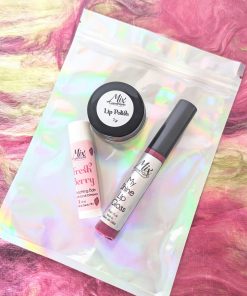 Ultimate Holiday lip care gift set includes Organic lip gloss, full size lip balm, and mini lip polish kit in fresh berry an Eco-friendly holiday beauty gift option and a fun Lip care stocking stuffer for Smooth, hydrated lips