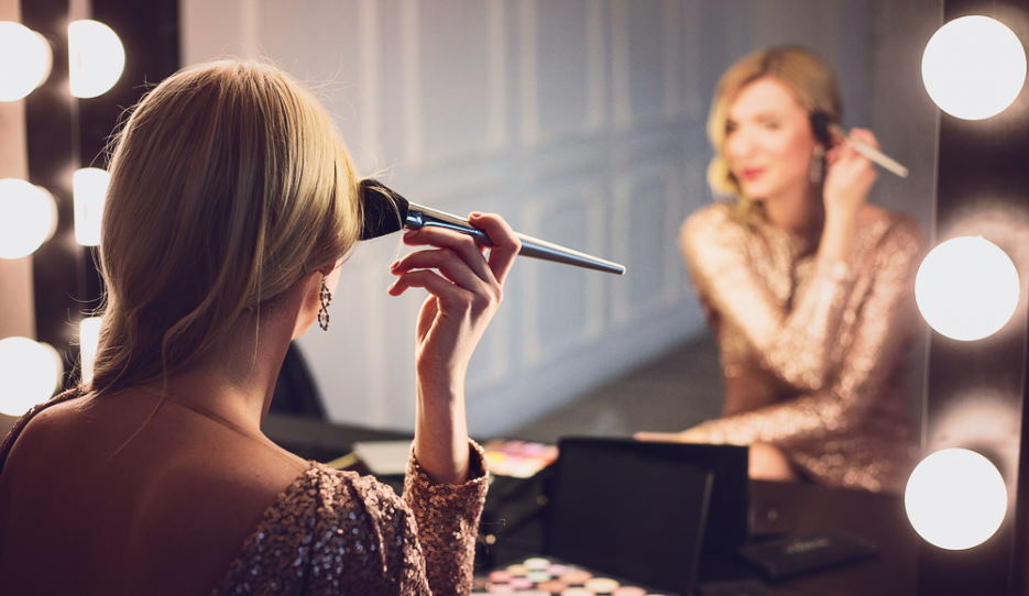 performer applying professional quality stage makeup