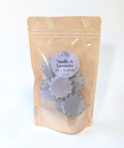 Lavender and Vanilla Micro Scrubbies in light lavender, displayed in a bag to show shape and size. Five Micro Scrubbies in the product bag to show packaging and quantity.